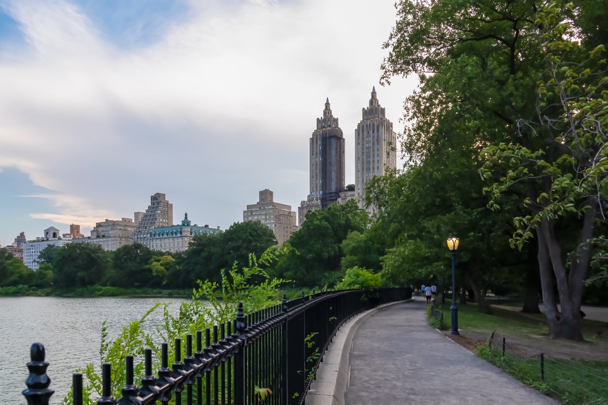 A peaceful path through Central Park in New York City, one of the trips that get easier and cheaper when travelers skip expensive attractions.