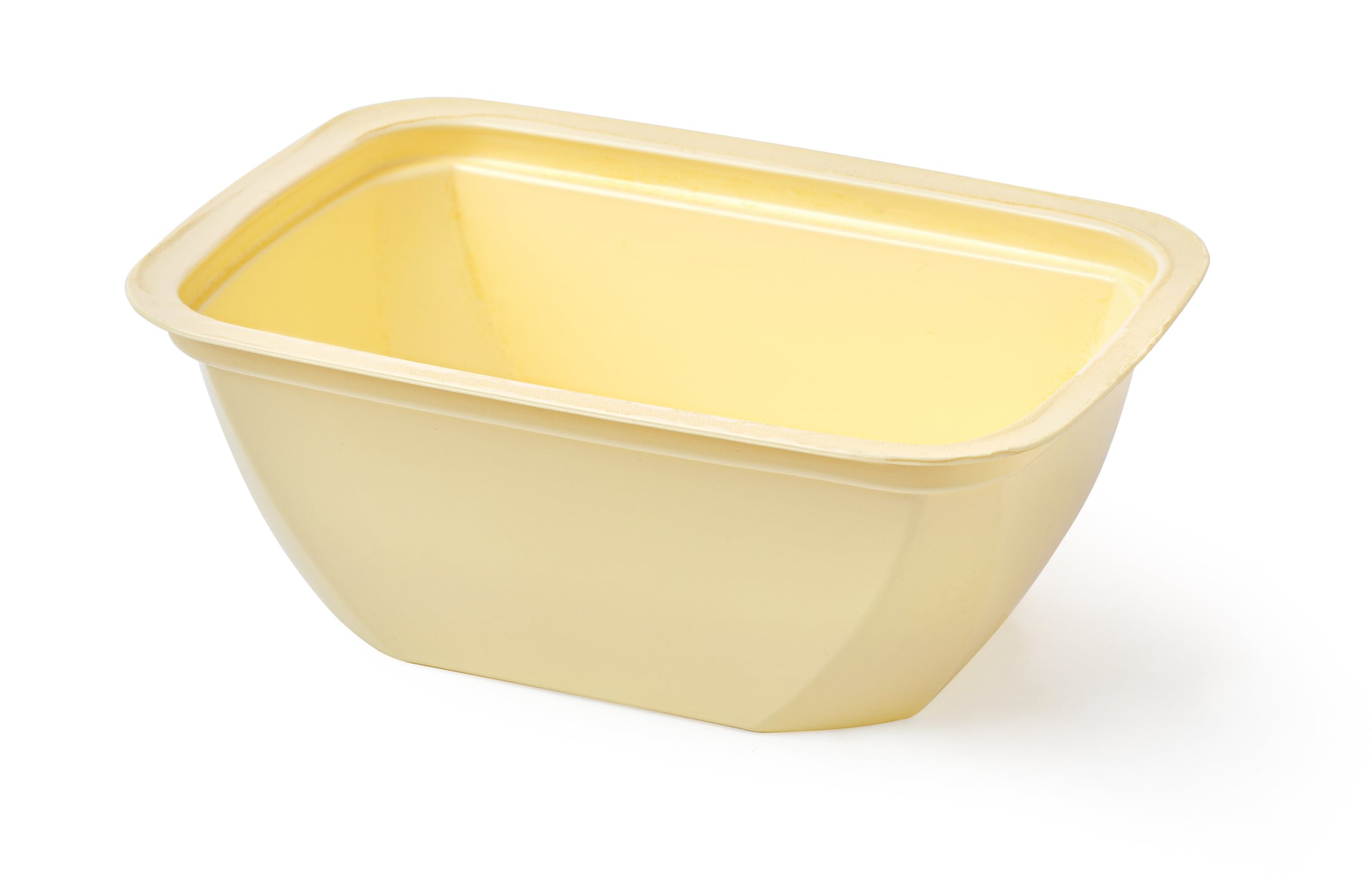 Empty pale yellow rectangular plastic food container of the type boomers saved.