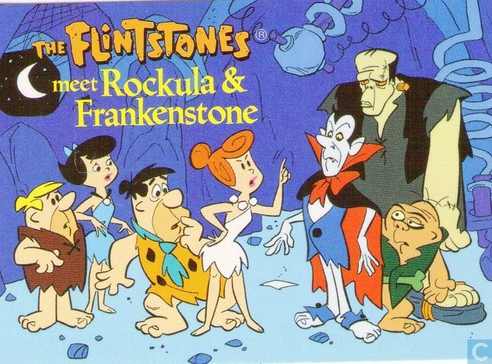 Title card for the cartoon “The Flintstones Meet Rockula and Frankenstone,” featuring the Flintstone family meeting a vampire and a monster in a rocky landscape.