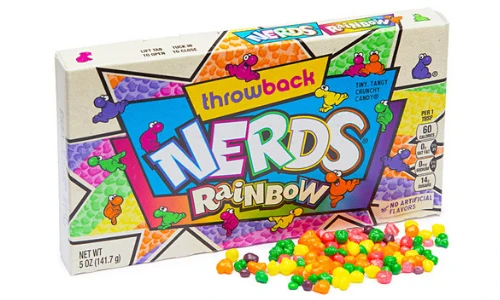 A box of Rainbow Nerds candy with small, colorful candy pieces scattered in front of it.