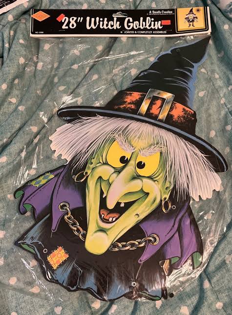 A 28-inch jointed witch goblin Halloween decoration in its original packaging.