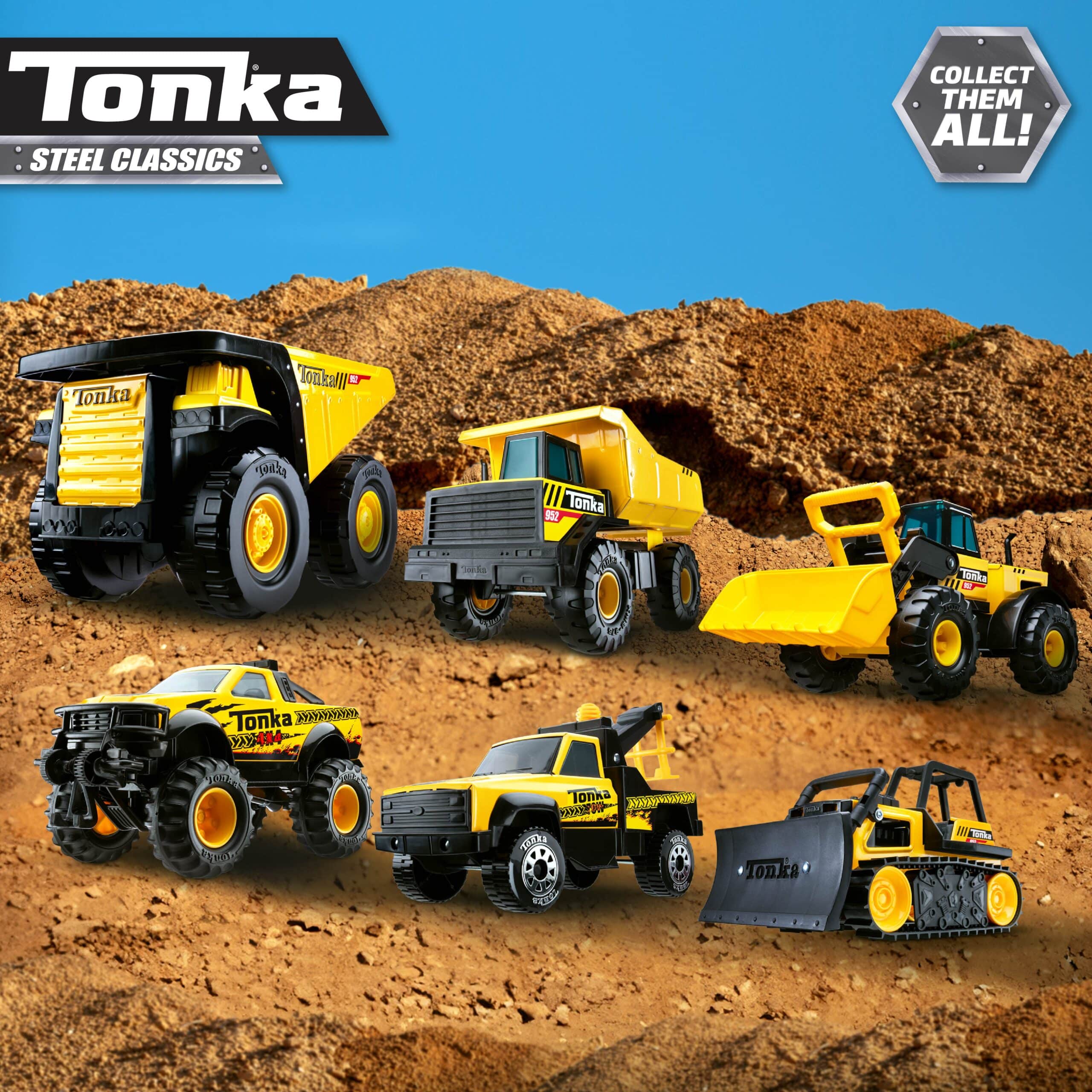 Six yellow and black Tonka Steel Classics construction vehicles displayed on a dirt background.
